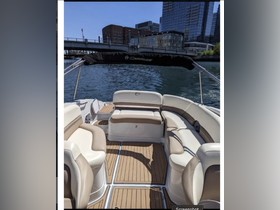 A spacious interior view of a boat showcasing comfortable seating and a well-designed cabin area, perfect for relaxing on the water.
