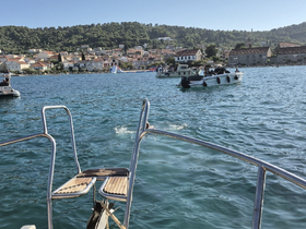 A scenic view from a boat showcasing the beautiful coastline and harbor activity, perfect for exploring the vibrant waterfront.