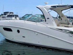 A sleek view of a Sundancer yacht docked at the marina, showcasing its elegant design and structure — perfect for luxury cruising.