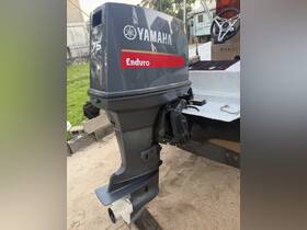 Close-up of a Yamaha Enduro 75 outboard engine, showcasing its robust design — essential for powering various types of boats.