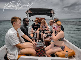 A lively group prepares for snorkeling on a boat, showcasing family fun and adventure in the water. Perfect for capturing memorable moments during aquatic excursions.