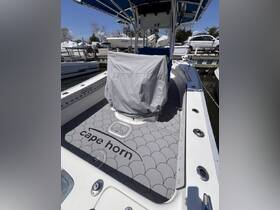A detailed view of the interior helm area of a Cape Horn boat, showcasing the sleek design and functional layout, perfect for fishing or cruising.