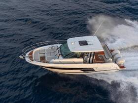 Aerial view of a sleek speedboat cruising through open waters, showcasing its elegant design and powerful performance.