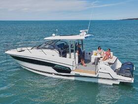 A group enjoys a relaxing day on a stylish boat, complete with cocktails and stunning ocean views — perfect for social outings and leisure on the water.