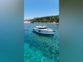A group enjoys a sunny day swimming near a stylish boat in crystal-clear waters, perfect for summer adventures and relaxation.