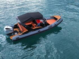 A sleek speedboat with a stylish design is anchored in clear waters, showcasing its elegant hull and spacious deck — perfect for day trips and water adventures.