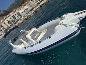 A sleek speedboat docked in clear waters, showcasing its modern design against a picturesque coastal backdrop.