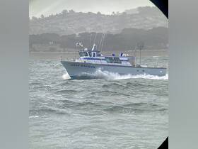 The 'New Rayann' speedboat cuts through the waves, showcasing its sleek design and performance on the water.