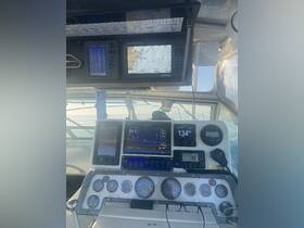 An interior view of a boat's helm showcasing advanced navigation and monitoring equipment, ideal for experienced captains and navigators.