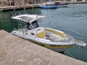 A sleek excursion speedboat docked at a picturesque harbor, showcasing its modern design and inviting atmosphere for water adventures.