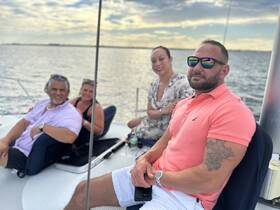 A group of friends enjoys a relaxing moment aboard a boat, capturing the essence of a perfect day on the water.