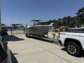 A sleek boat on a trailer, ready for transport, showcased in a marina setting — ideal for fishing or recreational outings.