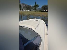 A clear view of the front deck of a boat, showcasing its sleek design and features, perfect for enjoying a day on the water.