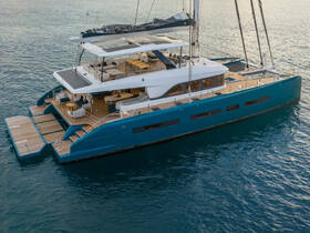 A stunning aerial view of a luxurious catamaran yacht anchored in calm waters, showcasing its elegant design and spacious deck, perfect for relaxation and entertaining.