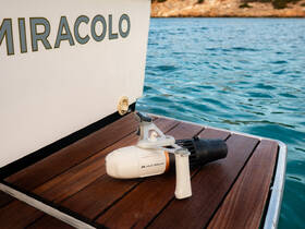 A close-up of a water toy displayed on the deck of a boat, showcasing the amenities available for fun on the water.