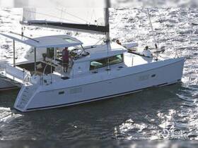 A sleek catamaran sails through shimmering waters, showcasing its elegant design and spacious layout, perfect for a day on the water.