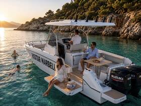 A lively scene at sunset with friends enjoying a boat party, swimming in crystal-clear waters, and savoring refreshments aboard a stylish vessel.