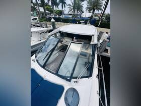 An interior view of a well-appointed boat helm, showcasing comfortable seating and a sleek design — perfect for a day on the water.