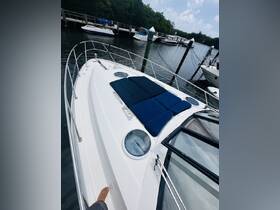A cozy lounge area on a boat featuring comfortable seating, perfect for relaxing while enjoying the water. The image captures the inviting space ideal for sunbathing or socializing.