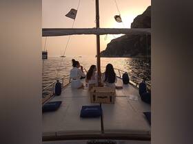 A group of friends enjoys a serene sunset on the deck of a yacht, creating perfect memories during their boating experience.