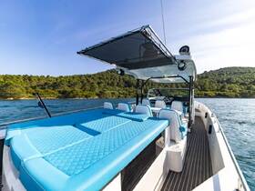 A spacious interior view of a boat featuring comfortable seating and a helm, perfect for enjoying a day on the water.