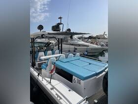 A well-designed interior of a modern boat featuring comfortable seating and a sleek helm, perfect for enjoying a day on the water.