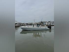 A boat navigates through a marina, showcasing an active day on the water with passengers enjoying the ride.