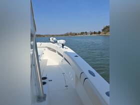 Interior view of a sleek boat helm showcasing the console and seating area, perfect for a day on the water.