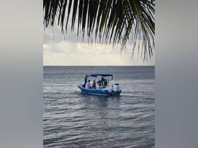 A group of friends enjoys a fishing trip on a small boat, cruising through calm ocean waters — perfect for a day of adventure and relaxation.