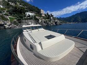 A stunning view of a yacht's front deck, showcasing its sleek design against a picturesque coastal backdrop — perfect for luxury cruising along scenic shores.