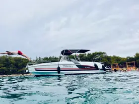 A child dives off the bow of a boat into the clear waters, capturing the excitement of summer fun and water activities with friends.