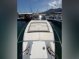 A clear view of a yacht's front deck docked at the marina, showcasing its sleek design and spacious layout, perfect for luxury outings.