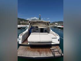 Interior view of a spacious boat cabin featuring comfortable seating and a sleek design, perfect for relaxing on the water.