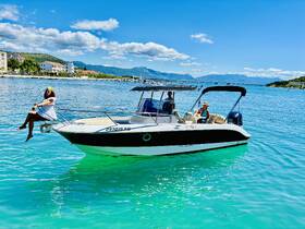 A lively scene on a boat with friends enjoying a sunny day on the water, perfect for summer outings and celebrations.