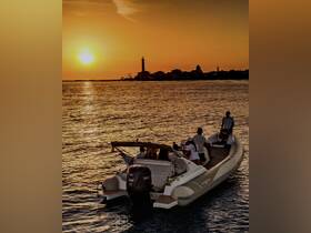 A group enjoys a picturesque sunset aboard a boat, creating a perfect backdrop for memorable moments on the water.
