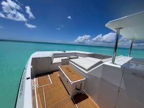 A stunning view of the boat's exterior against a backdrop of crystal-clear turquoise waters, perfect for enjoying a day on the sea.