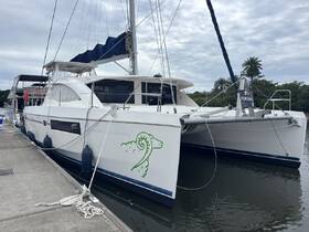 A sleek catamaran docked and available for sale, showcasing its modern design and spacious layout, perfect for future adventures on the water.