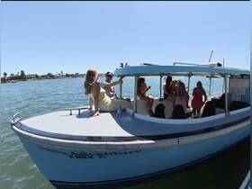 A lively group enjoys a fun day on the water aboard a boat, perfect for celebrations and gatherings with friends.