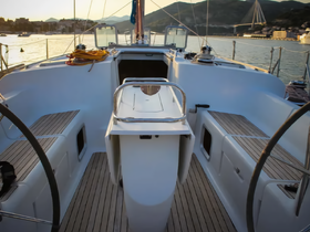 A well-designed helm area of a yacht, showcasing spacious seating and a modern console, perfect for navigating the open waters.