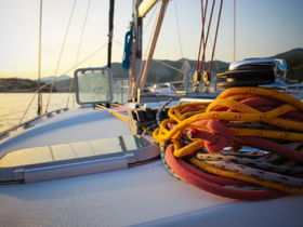 Close-up of colorful ropes and sailing equipment on a yacht, highlighting essential amenities for a smooth sailing experience.