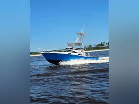 A sleek speedboat navigates the water, showcasing its impressive design and performance — perfect for thrilling adventures on the open sea.