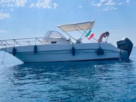A woman enjoys a sunny day on a boat, showcasing the perfect blend of relaxation and adventure on the open water.