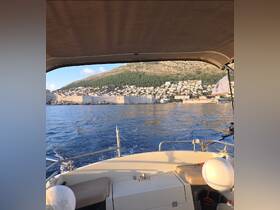 A scenic view from the boat showcasing a beautiful coastline and harbor, perfect for exploring picturesque destinations.