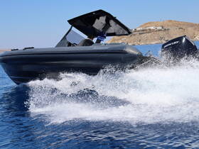 A sleek speedboat cuts through the clear blue waters, showcasing its dynamic design and performance while underway.