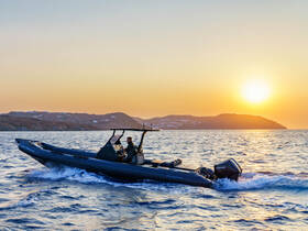 A sleek speedboat navigates the shimmering waters at sunset, showcasing the beauty of a tranquil evening on the sea.