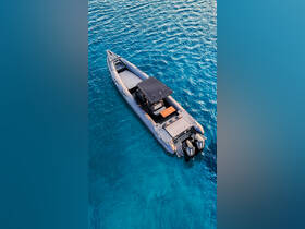 Aerial view of a sleek speedboat gliding through crystal-clear waters, showcasing its modern design and features — perfect for thrilling adventures on the sea.