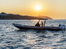 A sleek boat navigates the shimmering waters at sunset, capturing the essence of a perfect evening on the water.