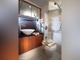 A stylish and modern boat bathroom featuring a sleek sink, elegant decor, and ample storage — perfect for comfort on the water.