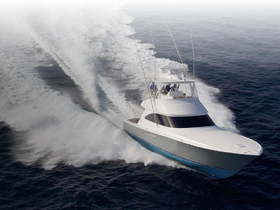 A sleek speedboat cuts through the waves, showcasing its powerful design and performance on the open water.