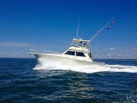 A sleek speedboat cuts through the waves, showcasing its impressive design and performance on the open water.